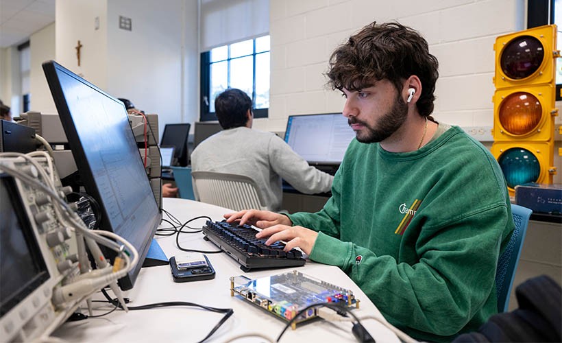A student works on a project at a computer