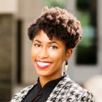 A woman smiling at the camera