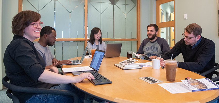 Theology graduate students in group discussion