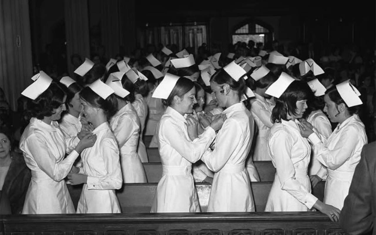 Villanova nursing students giving each other pins during a ceremony