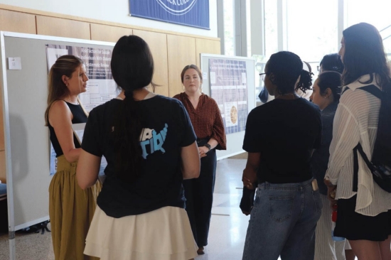 A student giving a presentation to a group of people