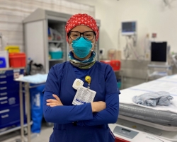 Diana Fok wearing scrubs in trauma bay