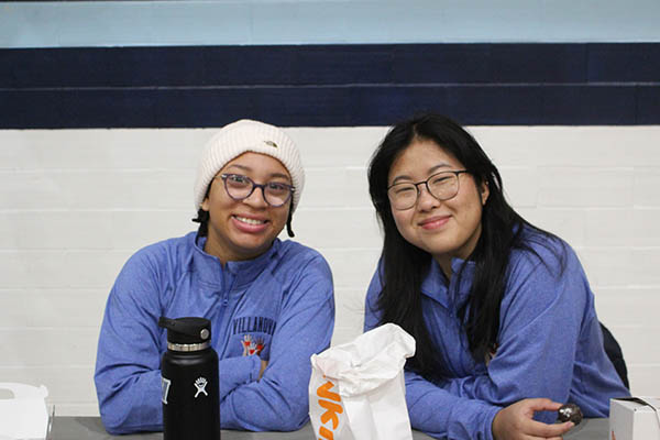 Two students smiling at camera