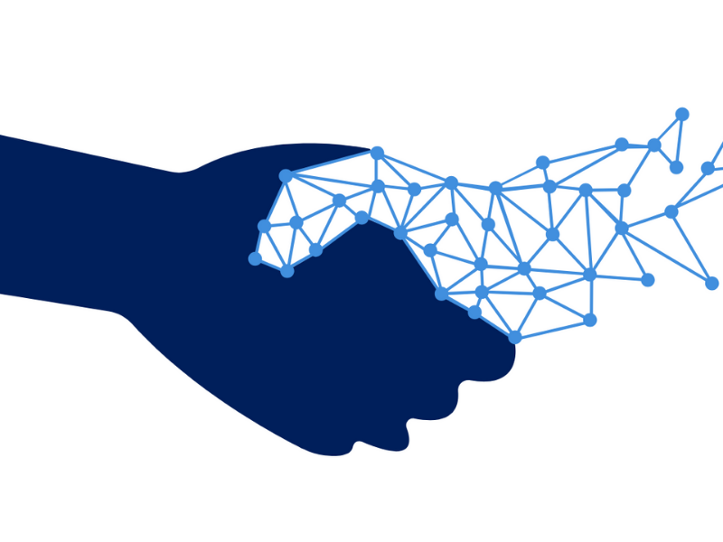 image of a human hand shaking a robotic AI-powered hand