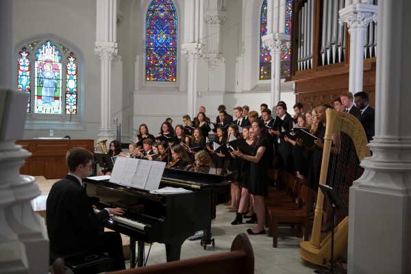 Image of a choral group performing during a religious service.