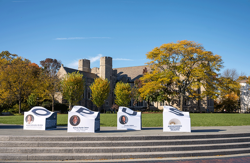 An outdoor Opus Prize display on campus celebrating the three finalists